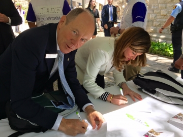 Signing Cards for students at the Telus Days of Giving Kits for Kids event on Parliament Hill